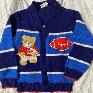 Baby cardigan with football and bear on it. Tag says 12 months.